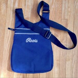 Vintage Roots nylon purse with adjustable strap.